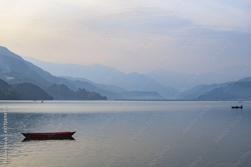 View over a colordul boat on Phewa Lake, Pokhara
