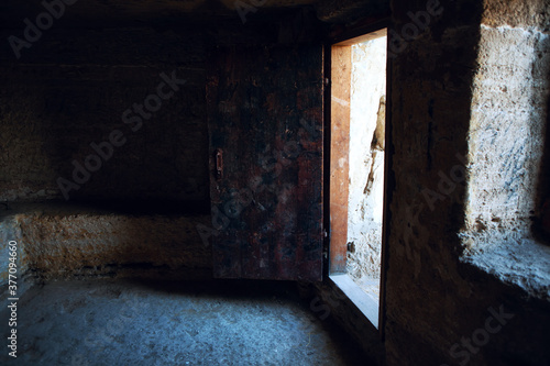 Empty stone room and open ancient door  © russieseo