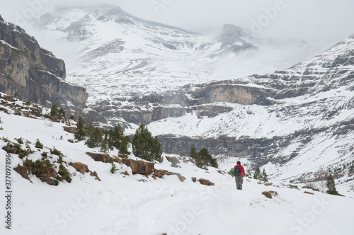 Man walking through the Ordesa Valley. Ordesa and Monte Perdido National Park. Pyrenees. Huesca. Aragon. Spain.