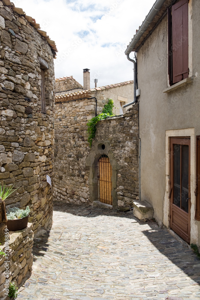 The medieval stone architecture and the old narrow street of Minerve, the most beautiful medieval village of France, located in the picturesque mountain  valley in Pyrenees
