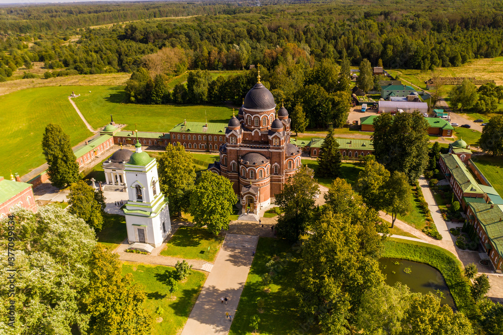an ancient monastery and surroundings at the site of the hostilities of the war of 1812 on the Borodino field filmed from a drone