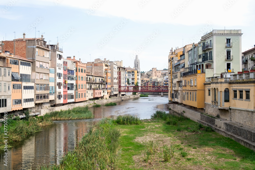 The beautiful cityscapeand the bridge upon Onyar river in the medieval city of Girona, Spain