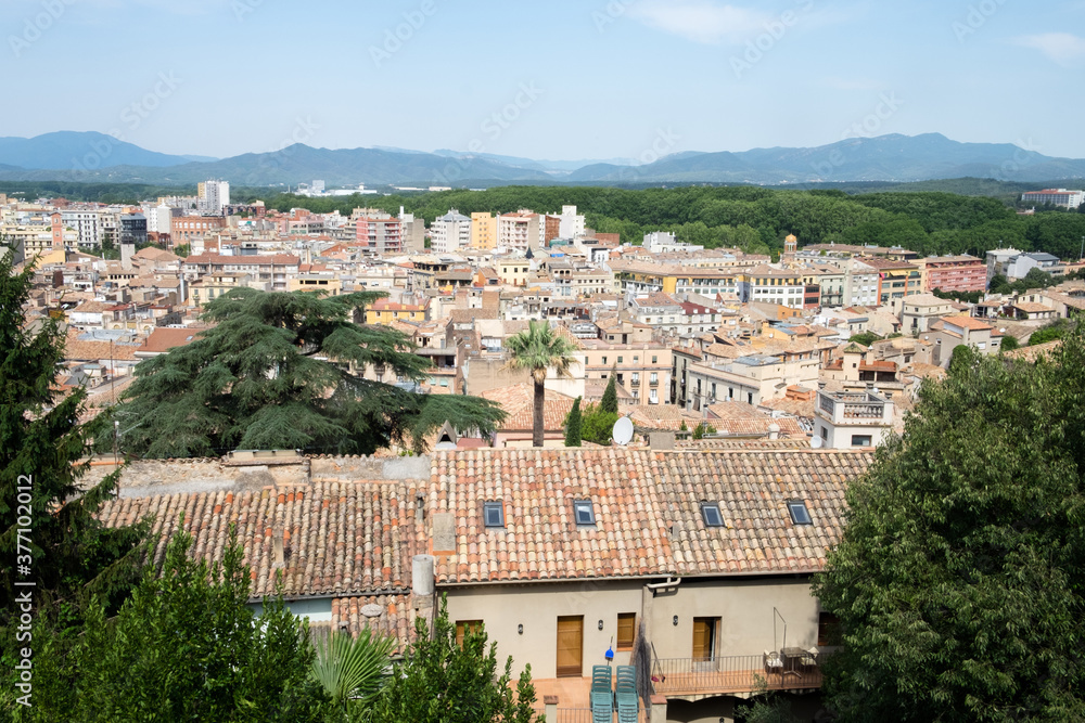 The beautiful cityscape, great cathedral and the red roofs of the medieval city of Girona, Spain