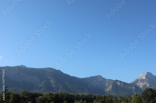 Mountains, forest and blue sky landscape
