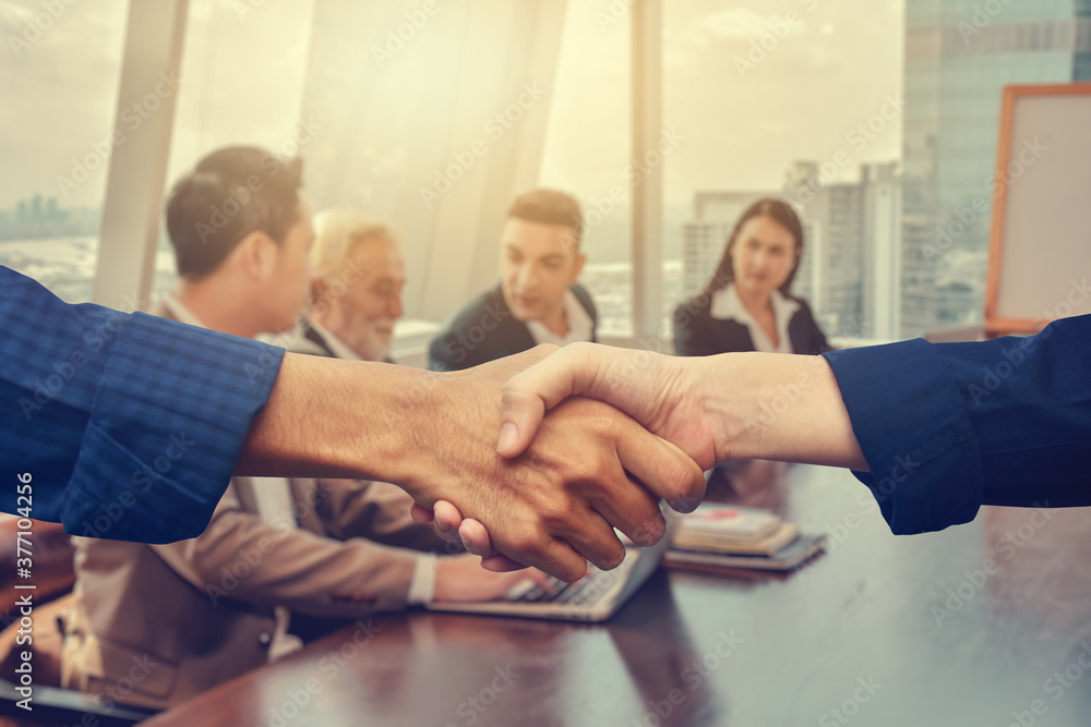 Obraz premium Close up people hands shake business partnership success,Shake hand concept