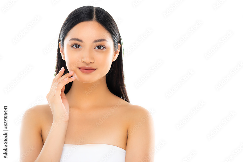 Young asian woman looking at camera and touching face isolated on white Young asian woman looking at camera and touching face isolated on white
