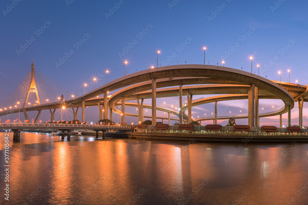 Motorway, Expressway, Freeway the infrastructure for transportation in modern city, urban view at twilight time..