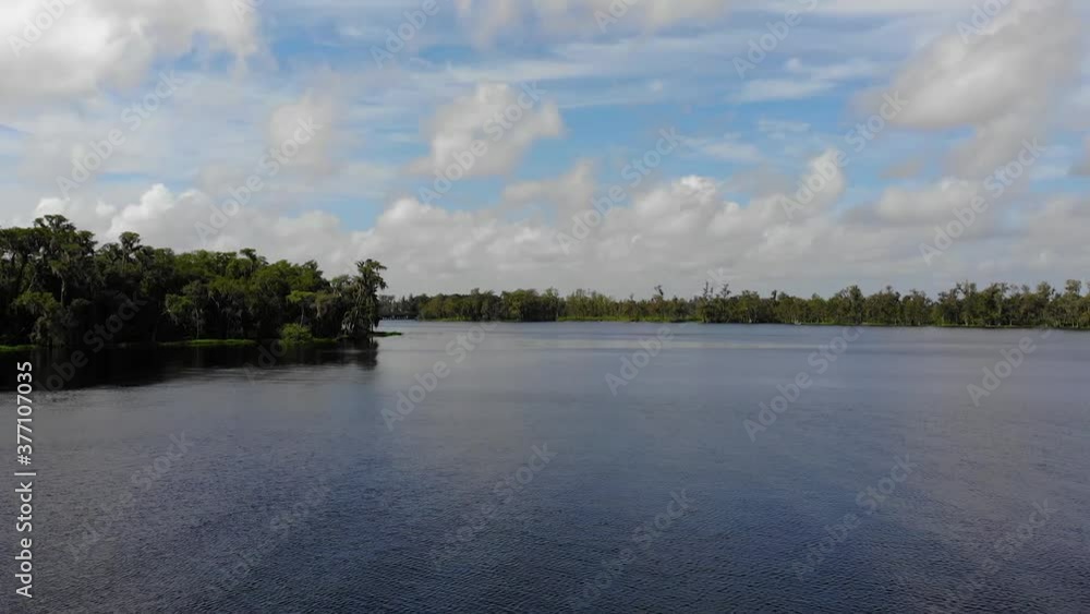 Aerial of a beautiful lake with some reflection of the clouds. Focus is low to the water. Aerial of a beautiful lake with some reflection of the clouds. Focus is low to the water.