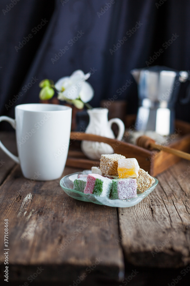 Turkish Delight - a gelatinous sweet confection traditionally made of syrup and cornflour, dusted with icing sugar. Still life food - oriental sweet rahat lokum . Candy marshmallow. Turkish Delight - a gelatinous sweet confection traditionally made of syrup and cornflour, dusted with icing sugar. Still life food - oriental sweet rahat lokum . Candy marshmallow.