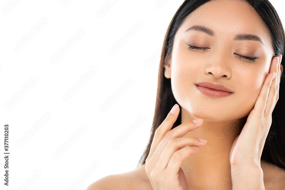 Young asian woman with closed eyes touching face isolated on white