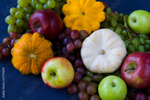 Fototapeta Naklejka Na Ścianę i Meble -  Autumn and fall harvest, pumpkin, apple, grape and pattison