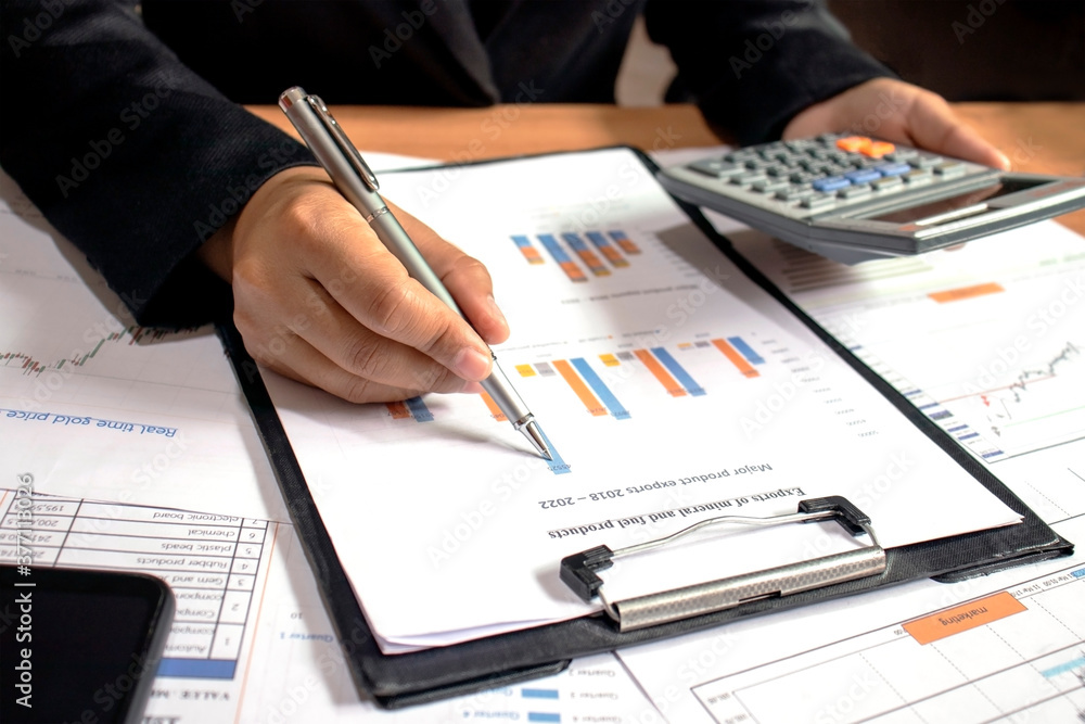 Businessmen are reviewing reports, financial documents for financial data analysis, work ideas and market data. Businessmen are reviewing reports, financial documents for financial data analysis, work ideas and market data.