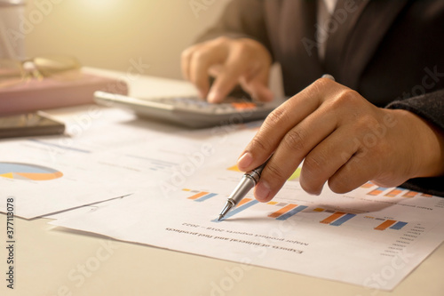 Businessmen are reviewing reports, financial documents for financial data analysis, work ideas and market data.