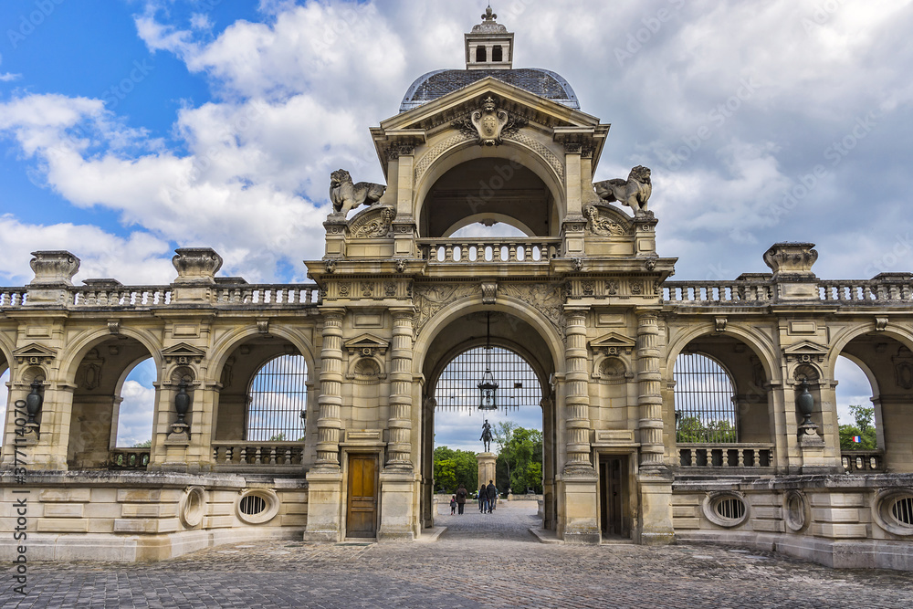 Fototapeta premium Architectural fragments of famous Chateau de Chantilly (Chantilly Castle, 1560) - a historic chateau located in town of Chantilly, Oise, Picardie, France.
