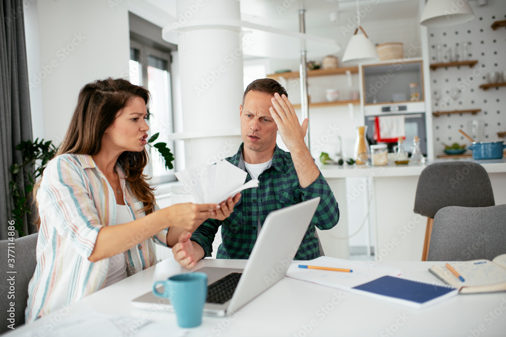 Husband and wife preparing bills to pay. Young couple having financial problems... Husband and wife preparing bills to pay. Young couple having financial problems...
