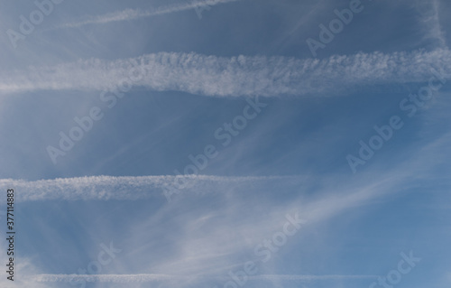 Contrails of airplanes in the sky of Huesca. Aragon. Spain.