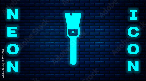 Glowing neon Paint brush icon isolated on brick wall background. For the artist or for archaeologists and cleaning during excavations. Vector.