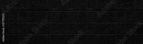 Panorama of Black stone block wall seamless background and pattern texture