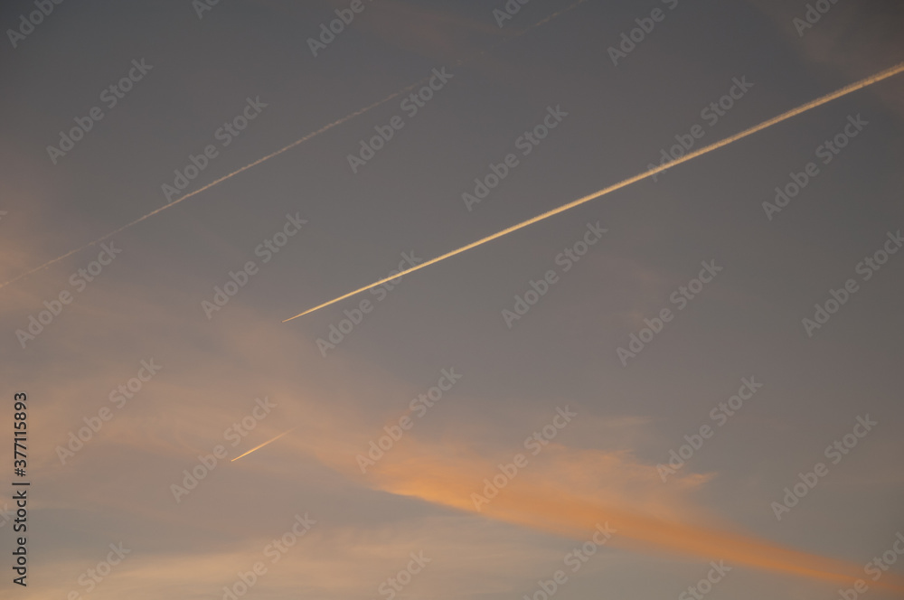 Airplanes and contrails of another airplanes at sunset. Huesca. Aragon. Spain. Airplanes and contrails of another airplanes at sunset. Huesca. Aragon. Spain.