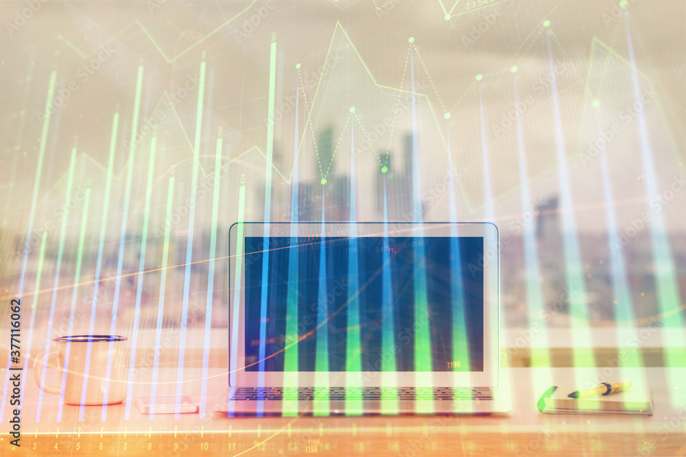 Stock market graph on background with desk and personal computer. Double exposure. Concept of financial analysis. Stock market graph on background with desk and personal computer. Double exposure. Concept of financial analysis.