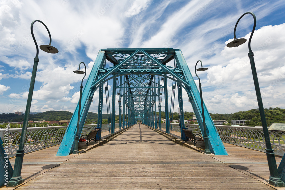 The famous Walnut Street Bridge is a pedestrian bridge that crosses over the Tennessee River in downtown Chattanooga Tennessee 