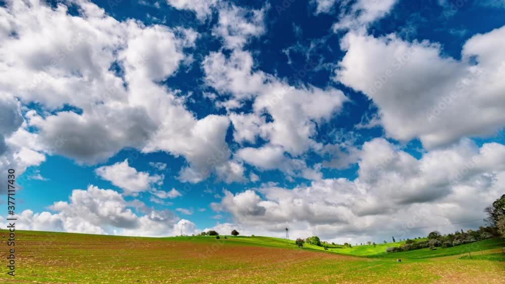 Clouds flowing on blue sky over green field. Time lapse Clouds flowing on blue sky over green field. Time lapse