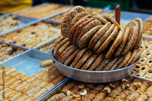 Traditional arabic sweets and bakery (dessert kadaif, kunafa, baklava, simits) in the Jerusalem market, Israel.