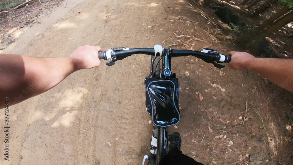 Pov Speed riding an enduro mountain bike in orange autumn forest. Downhill ride in woods Pov Speed riding an enduro mountain bike in orange autumn forest. Downhill ride in woods