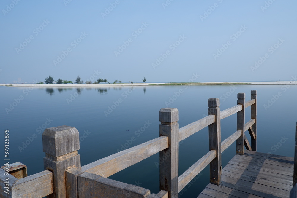 wooden pier on peaceful blue