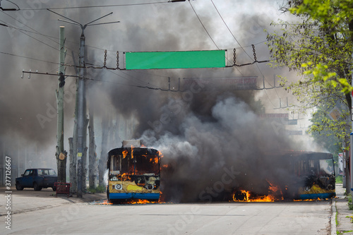 Burnt trolleybus. War in Donbass. Eastern Ukraine. photo