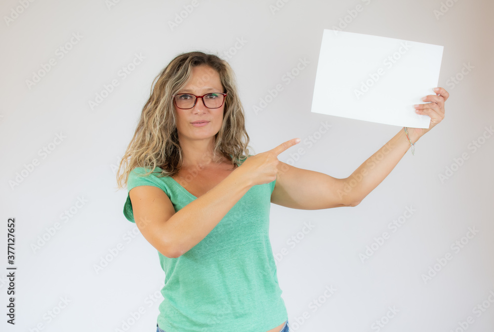 Beautiful woman with glasses pointing to a paper Beautiful woman with glasses pointing to a paper