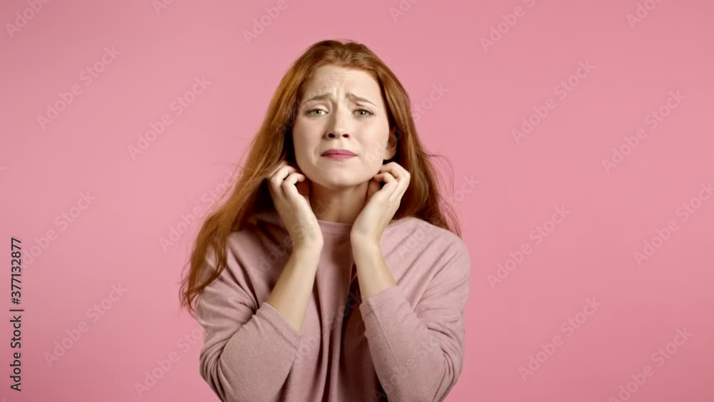 Young scared girl shouting loud isolated over pink background. Stressed and depressed woman trying to get attention. Concept of help and safe Young scared girl shouting loud isolated over pink background. Stressed and depressed woman trying to get attention. Concept of help and safe
