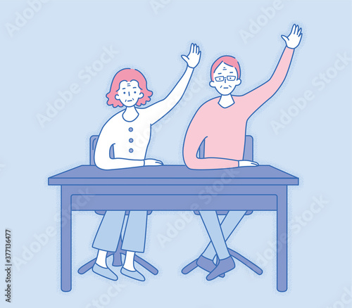 Poker-faced elderly couple raising hands
