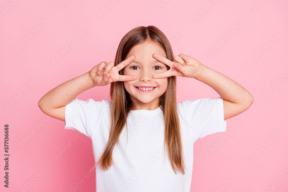 Photo of nice adorable pretty kid enjoy spring free time make v-sign wear good look clothes isolated over pink color background Photo of nice adorable pretty kid enjoy spring free time make v-sign wear good look clothes isolated over pink color background