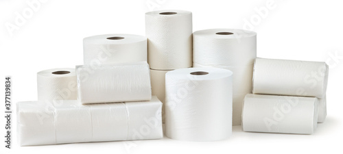 Rolls of toilet paper, paper towels and packs of napkins isolated on white background