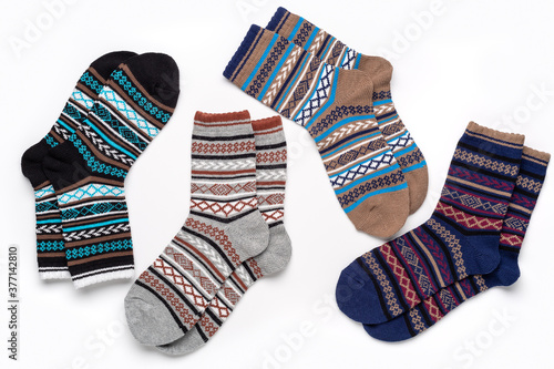 Composition of multi-colored socks with an ornament for sports and leisure in cold weather.