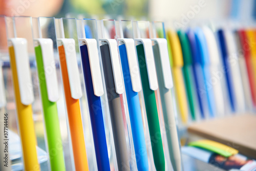 Colored plastic pens on store display