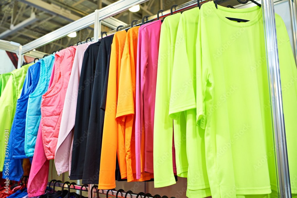 Colorful clothes on hanger in store