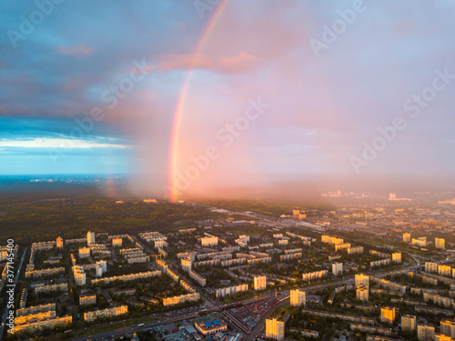 Rainbow and rain over Kiev city. Aerial drone view.