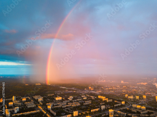 Rainbow and rain over Kiev city. Aerial drone view.