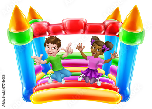 Children jumping and bouncing on a kids bouncy inflatable castle house