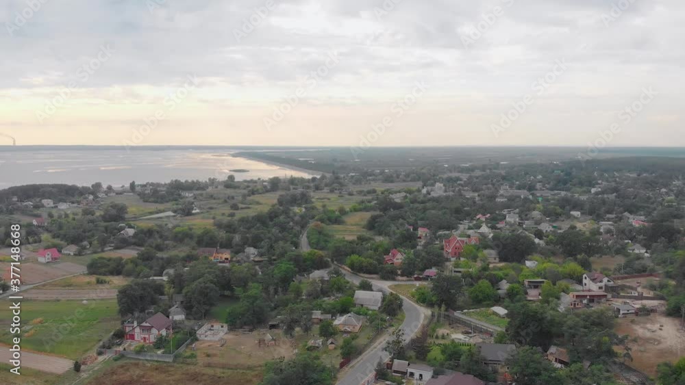 River and suburb private houses on the shore aerial drone left side camera movement River and suburb private houses on the shore aerial drone left side camera movement