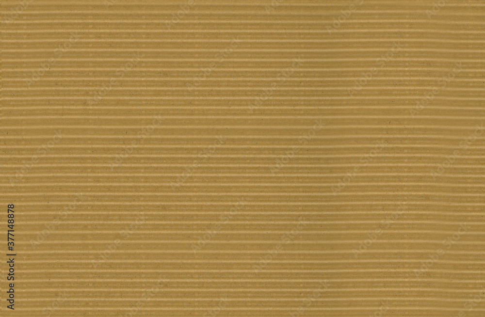 Corrugated cardboard or brown paper box sheet texture for background. Corrugated wavy brown cardboard texture. Corrugated cardboard or brown paper box sheet texture for background. Corrugated wavy brown cardboard texture.