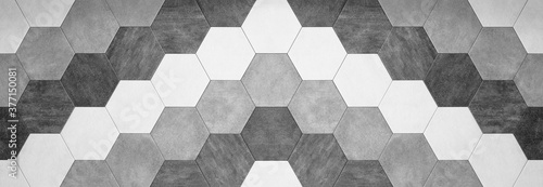 Abstract seamless bright white gray grey anthracite concrete cement stone tile wall made of hexagonal geometric hexagon print texture background banner panorama