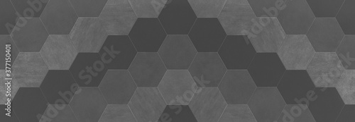 Abstract seamless anthracite dark gray grey concrete cement stone tile wall made of hexagonal geometric hexagon print texture background banner panorama