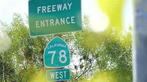 Freeway entrance sign on interchange crossraod in San Diego county, California USA. State Route highway 78 signpost plate. Symbol of road trip, transportation and traffic safety rules and regulations. photo