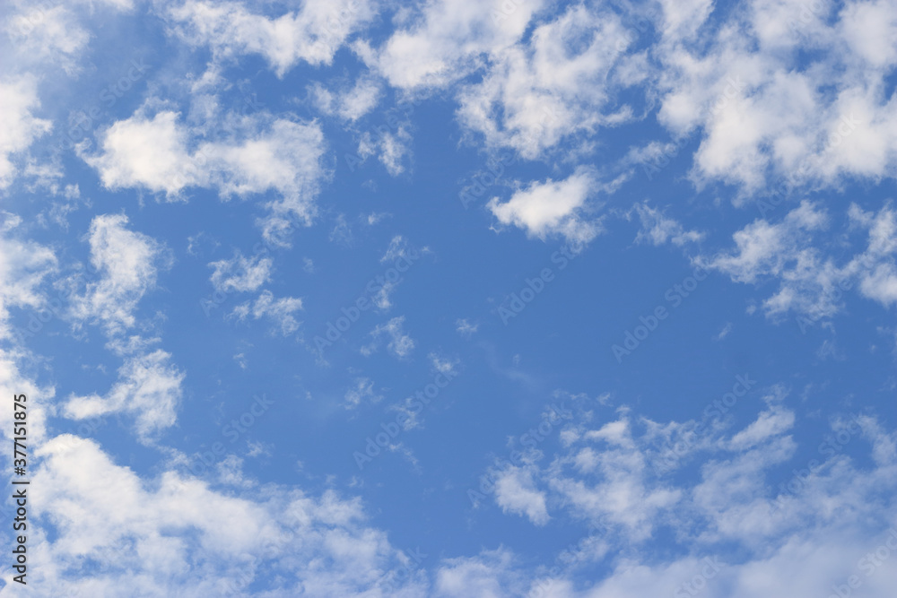 Clear sky with clouds scattered across the sky Clear sky with clouds scattered across the sky