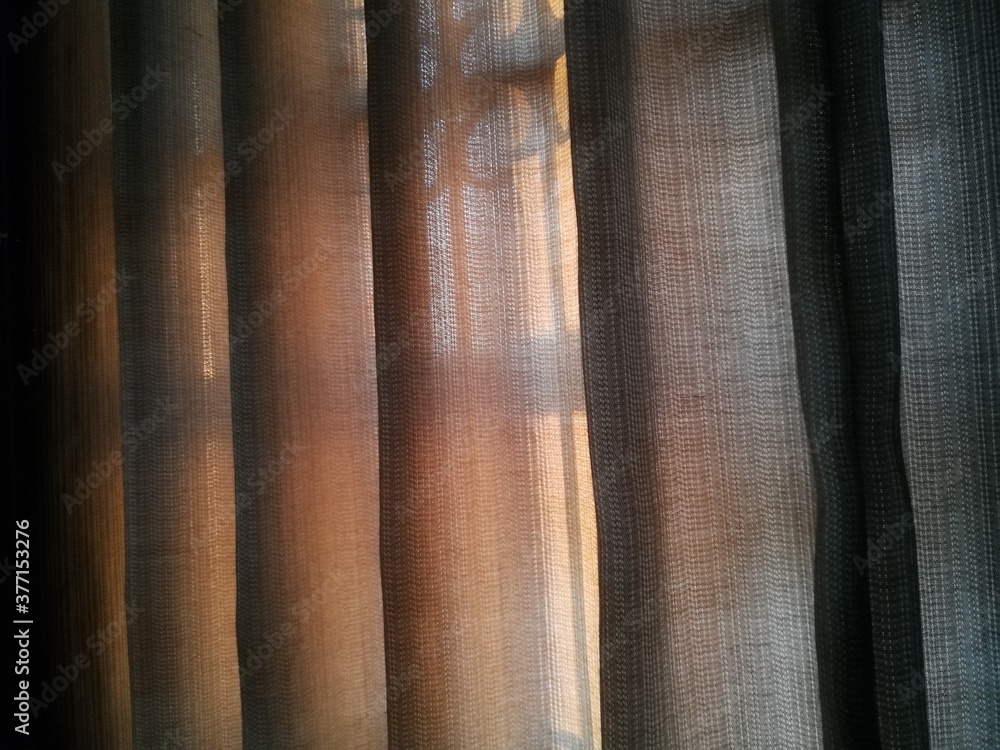 Fototapeta premium Sunlights through transparent curtains in bedroom