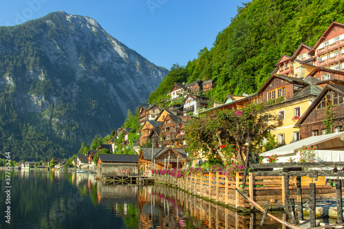 Classic postcard view of famous Hallstatt lakeside town  Austria. Scenic panoramic view of beautiful town reflecting in Hallstatter See.Beautiful sunny day in summer  Salzkammergut region.Urban scene