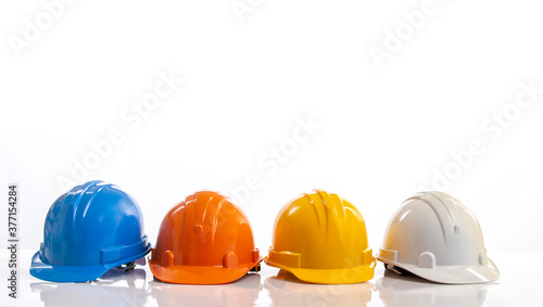 Photography Four construction helmets, hard safety helmet hat for engineer or worker isolate